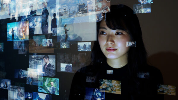 Woman looking at digital screens and data streams – Miso Film case story at Corpital

